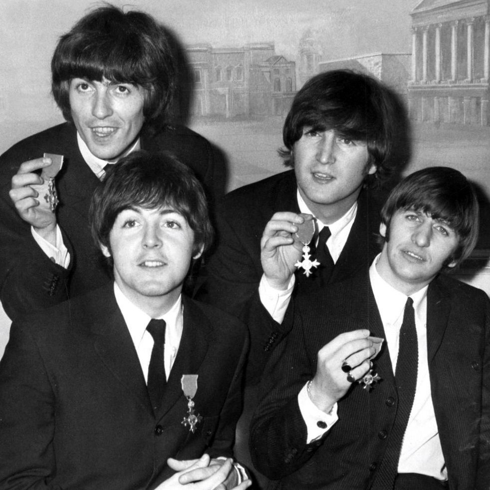 A photo of the Beatles with their MBE medals. Original source: Beatles Archive, www.beatlesarchive.net/the-beatles-honoured-with-an-mbe.html.